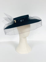 wide brimmed black satin boater hat with veiling netting